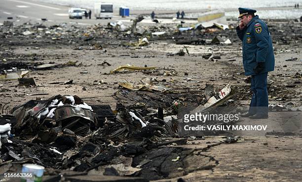 Russian Emergency Ministry officer examines the wreckage of a crashed air-plane at the Rostov-on-Don airport on March 20, 2016. A flydubai passenger...