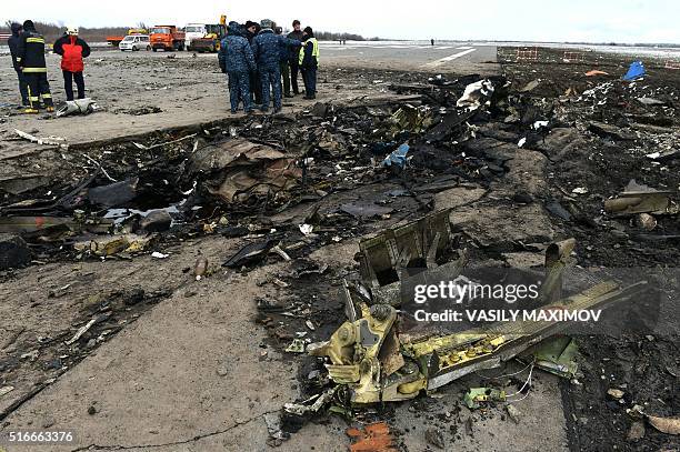 Russian Emergency Ministry rescuers examine the wreckage of a crashed air-plane at the Rostov-on-Don airport on March 20, 2016. A flydubai passenger...