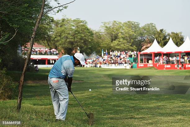 Chawrasia of India plays his approach shot on the 18th hole during the final round of the Hero Indian Open at Delhi Golf Club on March 20, 2016 in...
