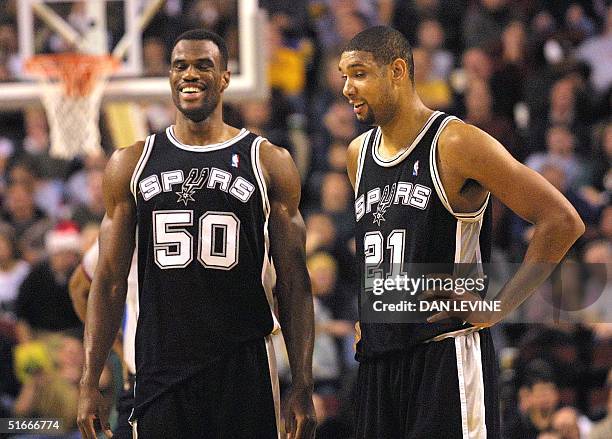 San Antonio Spurs David Robinson and Tim Duncan breath sighs of relief after they completed an "Alley-Oop" basket by Robinson against the Seattle...