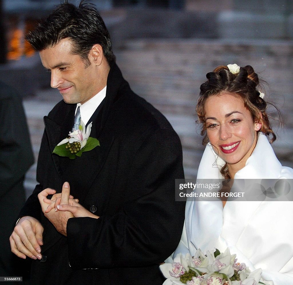 Canadian singer Roch Voisine (L) and his bride Myr