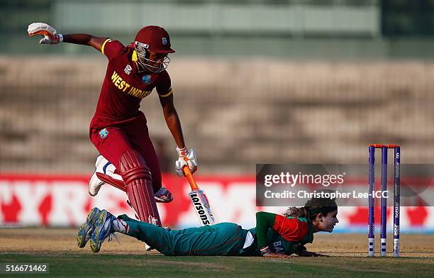 Jahanara Alam, Captain of Bangladesh nearly runs out Stacy-Ann King of the West Indies during the Women's ICC World Twenty20 India 2016 Group B match...