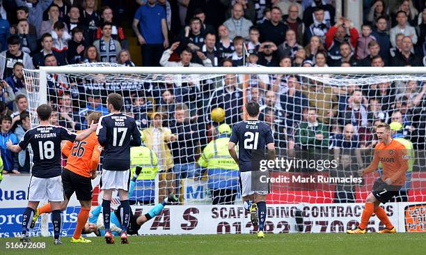 Billy McKay of Dundee United scores from the penalty spot early in the second half during the Ladbrokes Scottish Premiership match between Dundee...