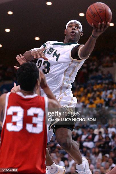 St. Vincent-St. Mary's LeBron James goes up for a basket past Mater Dei's Marcel Jones in the second quarter, in Los Angeles, CA, 04 January 2003....