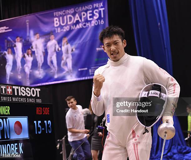 In this handout image provided by the FIE, Kazuyasu Minobe of Japan competes during the individual men's epee match and qualifies for the Rio Olympic...