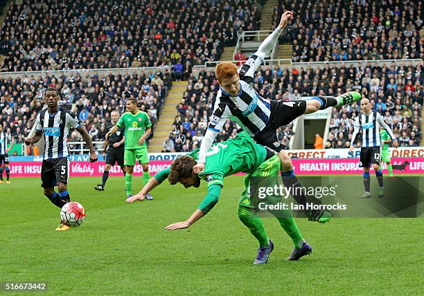 Fabio Borini of Sunderland is fouled by Jack Colback of Newcastle during the Barclays Premier League match between Newcastle United FC and Sunderland...