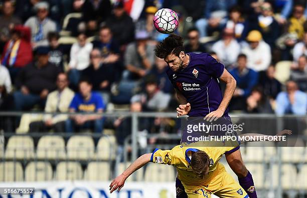 Fiorentina's defender from Spain Marcos Alonso Mendoza heads the ball with Frosinone's defender from Italy Matteo Ciofani during the Italian Serie A...