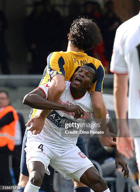 Isaac Cofie of Carpi FC is chellenged by Luca Toni of Hellas Verona during the Serie A match between Hellas Verona FC and Carpi FC at Stadio...