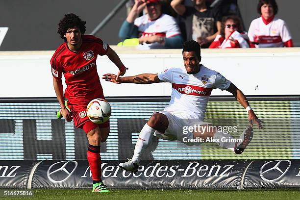 Daniel Didavi of Stuttgart is challenged by Andre Ramalho of Leverkusen during the Bundesliga match between VfB Stuttgart and Bayer Leverkusen at...