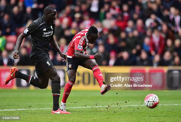 Sadio Mane of Southampton beats Mamadou Sakho of Liverpool to score their third goal during the Barclays Premier League match between Southampton and...