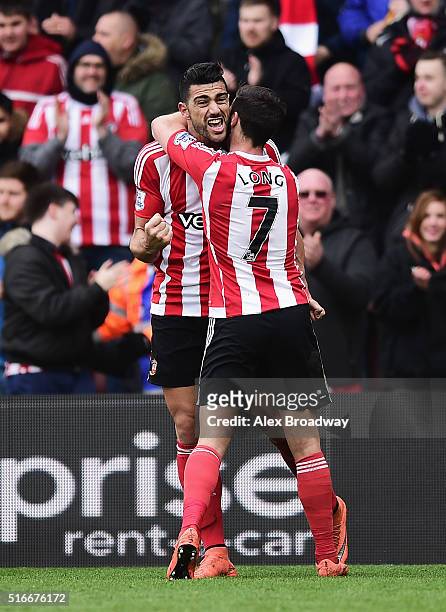 Graziano Pelle of Southampton celebrates with team mate Shane Long as he scores their second goal during the Barclays Premier League match between...