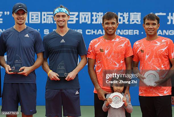 Denys Molchanov of Ukraine, Alexander Kudryavtsev of Russia, Sanchai Ratiwatana of Thailand and Sonchat Ratiwatana of Thailand with their trophy...