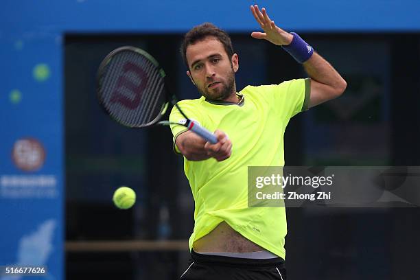 Marsel Ilhan of Turkey returns a shot during the match against Lukas Lacko of Slovakia during the 2016 "GDD CUP" International ATP Challenger...