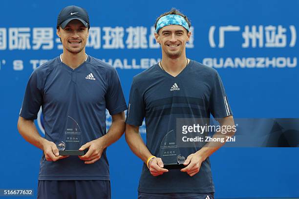 Denys Molchanov of Ukraine and Alexander Kudryavtsev of Russia with their trophy after winning the doubles final match against Sanchai Ratiwatana of...
