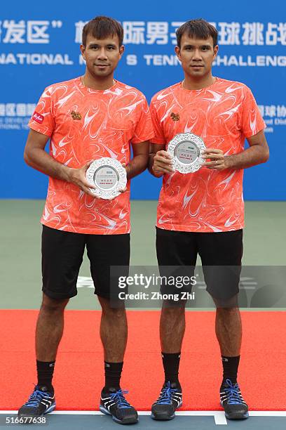 Sanchai Ratiwatana of Thailand and Sonchat Ratiwatana of Thailand with their trophy after losing the doubles final match against Denys Molchanov of...