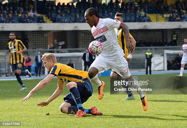Filip Helander of Hellas Verona competes with Jerry Mbakogu of Carpi FC during the Serie A match between Hellas Verona FC and Carpi FC at Stadio...