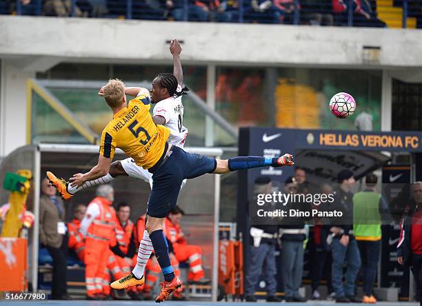 Filip Helander of Hellas Verona competes with Jerry Mbakogu of Carpi FC during the Serie A match between Hellas Verona FC and Carpi FC at Stadio...