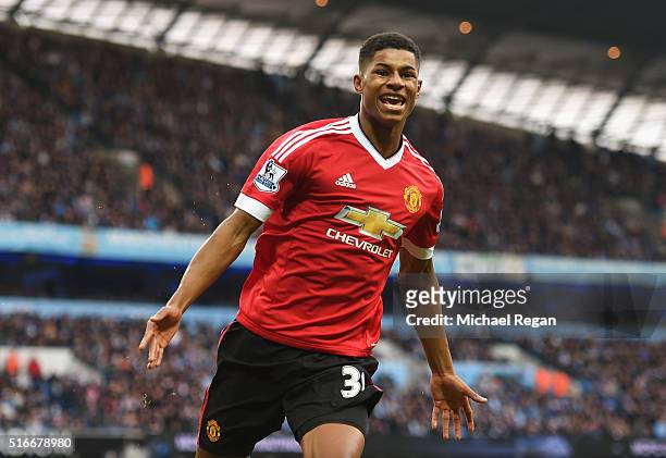Marcus Rashford of Manchester United celebrates as he scores their first goal during the Barclays Premier League match between Manchester City and...