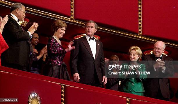 President George W. Bush , with First Lady Laura Bush are applauded by, Vice President Richard Cheney , his wife Lynne Cheney , and actor James Earl...