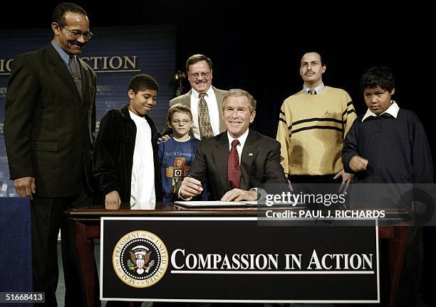 President George W. Bush signs an Executive Order on Equal Treatment for Charities after elivering remarks on his Faith-based initiative at the...