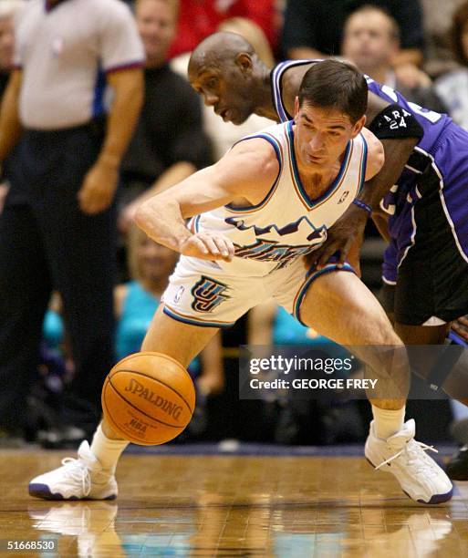 John Stockton of the Utah Jazz steals the ball from Bobby Jackson of the Sacramento Kings during the first quarter, 14 December, 2002 in Salt Lake...