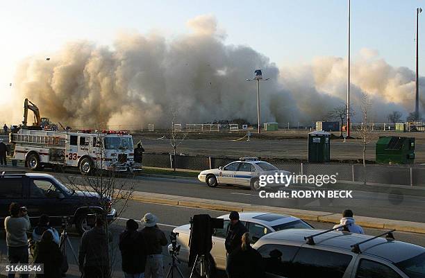 The US Airways Arena in Landover, Maryland collapses as the building is destroyed to make way for a shopping center, 15 December 2002. The venue,...