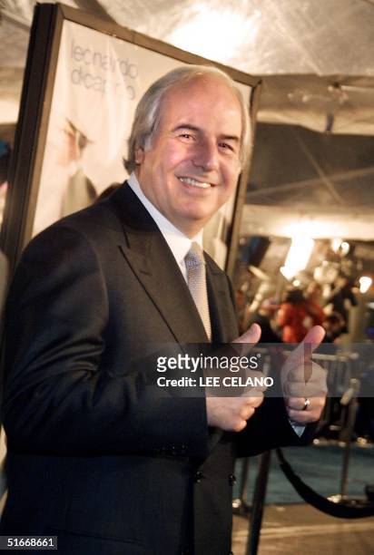 One-time fugitive Frank Abagnale gives a thumbs up as he arrives for the premiere of the film "Catch Me If You Can", 16 December 2002 in the Westwood...