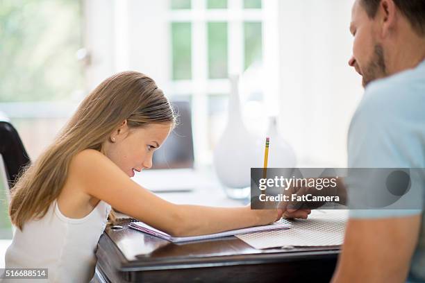 father helping his daughter with homeschool - tank top back stock pictures, royalty-free photos & images