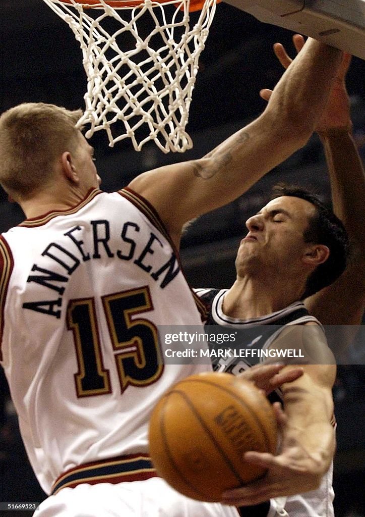 San Antonio Spurs' Emanuel Ginobili (R) hooks the