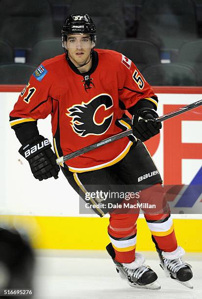 Ken Agostino of the Calgary Flames plays against the Vancouver Canucks during the preseason game at Scotiabank Saddledome on September 25, 2014 in...