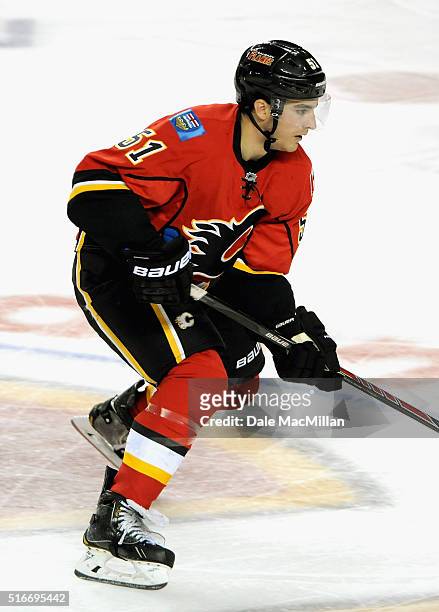 Ken Agostino of the Calgary Flames plays against the Vancouver Canucks during the preseason game at Scotiabank Saddledome on September 25, 2014 in...