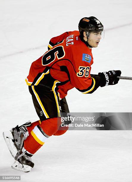 Raphael Diaz of the Calgary Flames plays against the Vancouver Canucks during the preseason game at Scotiabank Saddledome on September 25, 2014 in...
