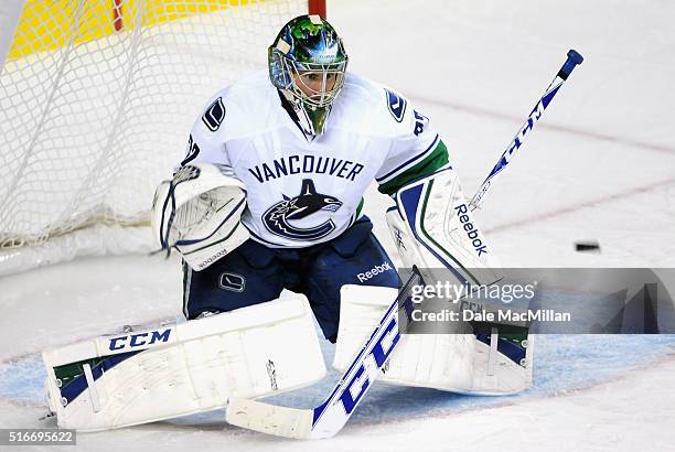Goaltender Joacim Eriksson of the Vancouver Canucks plays against the Calgary Flames during the preseason game at Scotiabank Saddledome on September...