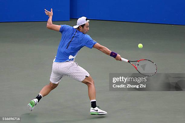 Ze Zhang of China returns a shot during the match against Lukas Lacko of Slovakia during the 2016 ?GDD CUP? International ATP Challenger Guangzhou...