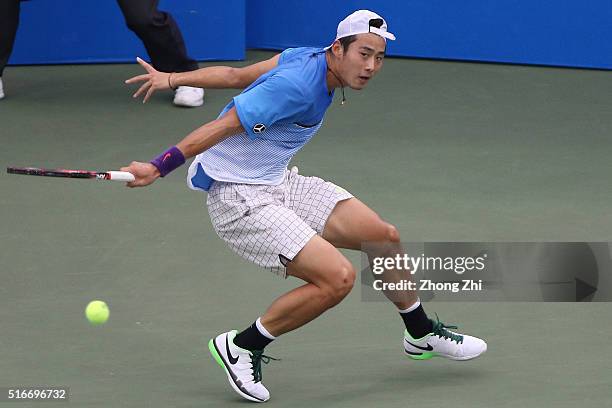 Ze Zhang of China returns a shot during the match against Lukas Lacko of Slovakia during the 2016 "GDD CUP" International ATP Challenger Guangzhou...