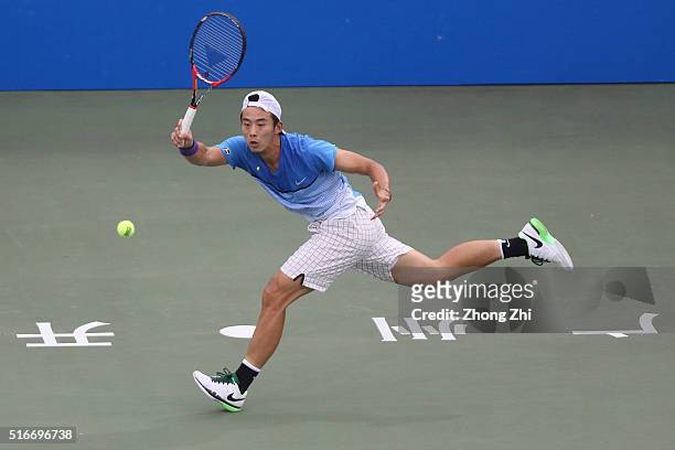 Ze Zhang of China returns a shot during the match against Lukas Lacko of Slovakia during the 2016 "GDD CUP" International ATP Challenger Guangzhou...
