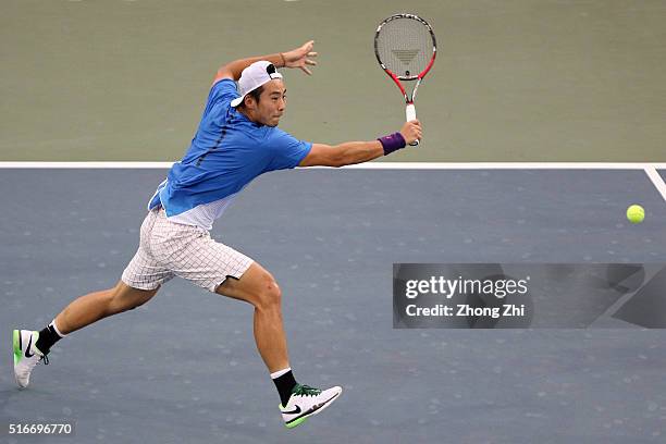 Ze Zhang of China returns a shot during the match against Lukas Lacko of Slovakia during the 2016 "GDD CUP" International ATP Challenger Guangzhou...