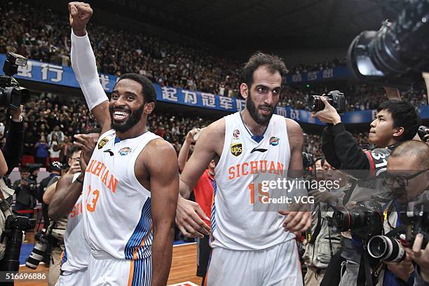 Mike Harris and Hamed Haddadi of Sichuan Blue Whales celebrate victory after the Chinese Basketball Association 15/16 season play-off final match...