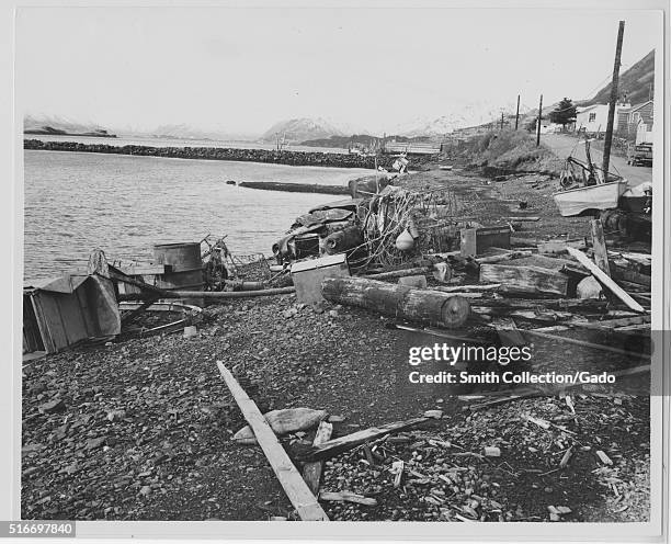 Photograph of debris left along the water after the 1964 Alaska earthquake, the debris was deposited after the water from the tsunami caused by the...