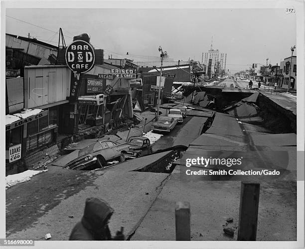 Photograph of Fourth Avenue in Anchorage following the 1964 Alaska Earthquake, an 11 foot subsidence occurred along with 14 feet of horizontal...