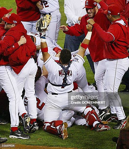 The Anaheim Angels' celebrate the last out of Game Seven of the World Series 27 October, 2002 in Anaheim against the San Francisco Giants. The Angels...