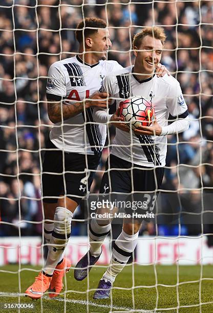 Christian Eriksen of Tottenham Hotspur celebrates with team mate Kyle Walker as he scores their third goal during the Barclays Premier League match...