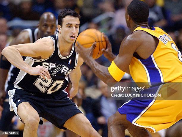 San Antonio Spurs' Argentinian rookie guard Emanuel Ginobili defends against Los Angeles Lakers' guard Kobe Bryant in the fourth quarter of their...