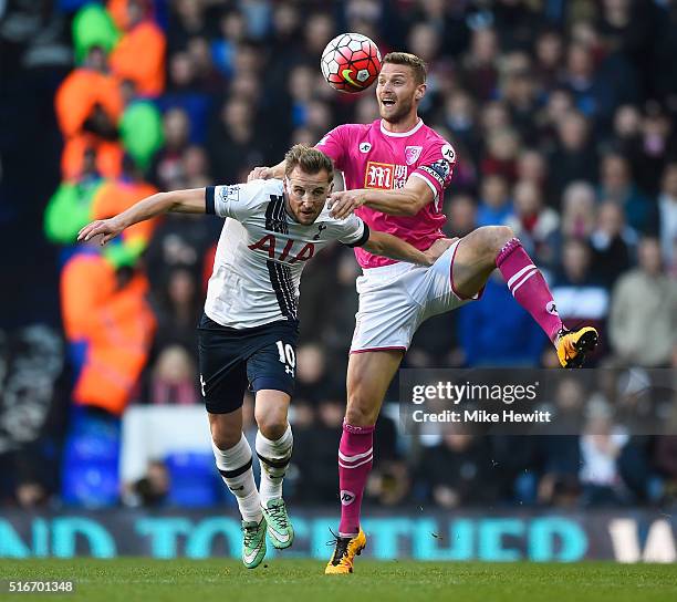 Simon Francis of Bournemouth outjumps Harry Kane of Tottenham Hotspur during the Barclays Premier League match between Tottenham Hotspur and A.F.C....