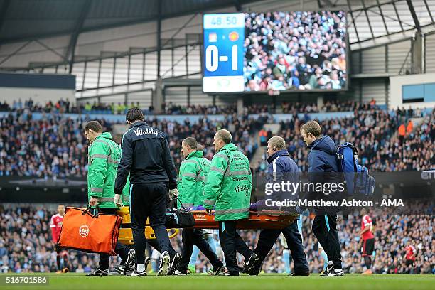 Joe Hart of Manchester City is stretchered off during the Barclays Premier League match between Manchester City and Manchester United at the Etihad...