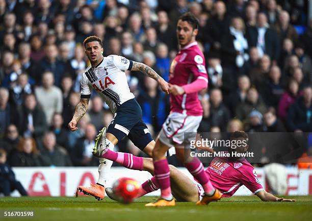 Kyle Walker of Tottenham Hotspur crosses the ball past Adam Smith and Steve Cook of Bournemouth during the Barclays Premier League match between...