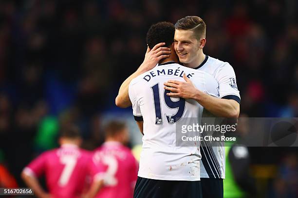 Mousa Dembele and Kevin Wimmer of Tottenham Hotspur celebrate victory after the Barclays Premier League match between Tottenham Hotspur and A.F.C....
