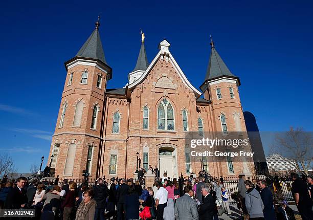 People wait outside the Provo City Center Temple of the Church of Jesus Christ of Latter Day Saints to attend the dedication on March 20, 2016 in...