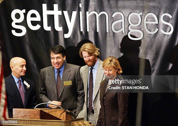 Mark Getty, Chairman of Getty Images , smiles after ringing the opening bell of the New York Stock Exchange with company CEO Jonathan Klein , chief...