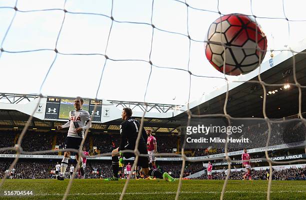 Christian Eriksen of Tottenham Hotspur scores their third goal past goalkeeper Artur Boruc of Bournemouth during the Barclays Premier League match...